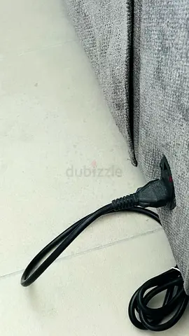 Grey fabric sofa (single piece) with power cable - good condition