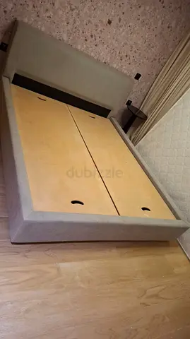 Upholstered queen bed frame with storage base