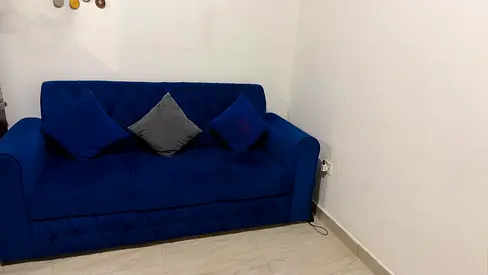 Blue velvet 3-seater sofa in good condition