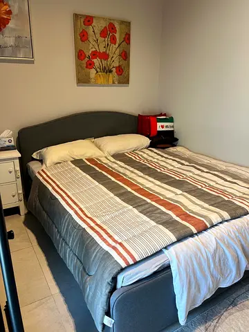 Grey fabric double bed frame with mattress and side tables and standing lamp (Good condition)