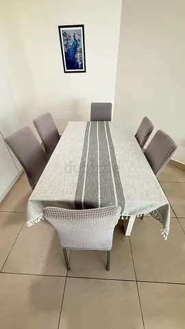 6-seater dining table with chairs and tablecloth - good condition. No physical damage or scratch