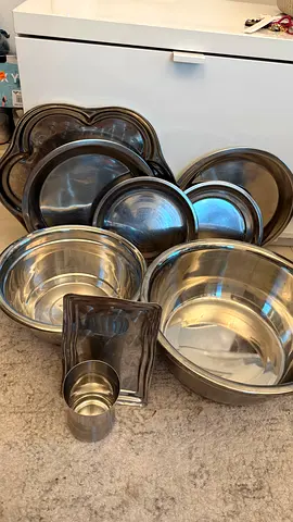 Set of stainless steel mixing bowls and kitchen prep bowls - used