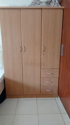 Three-door wooden wardrobe with drawers - good condition