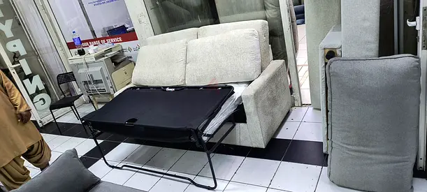 Light grey 2-seater sofa bed in good condition
