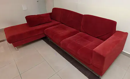 Red L-shaped 3-seater Sofa for immediate sale- Good Condition