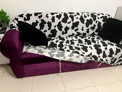 Purple 3-seater sofa with removable cow-print cover (good condition)