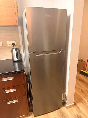 Silver Two-Door Refrigerator in Good Working Condition