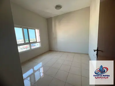 Excellent location in Al Majaz: Unit featuring a bedroom, a spacious living room, and a balcony with a wonderful view. Includes built-in wardrobes, an