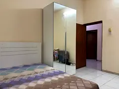 Spacious and Well ventilated Room with Balcony for Rent in Abu Shagara.