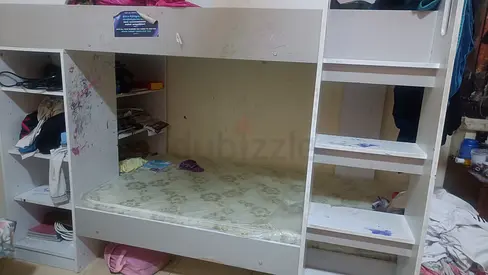 White wooden bunk bed with shelves and ladder - used