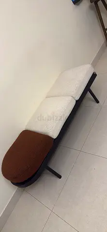 Modern upholstered bench with three-tone cushions