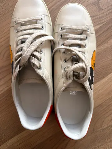 White Gucci sneakers with Mickey Mouse print, gently used