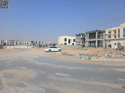 Corner plot for sale in a residential street, 4200 sq ft, in a prime location in Al-Haliou 2 area.