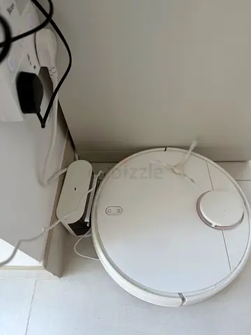 White robot vacuum cleaner with charging dock - good condition
