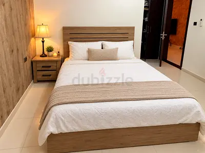 Queen size bed with mattress, and 2 matching bedside table - light oak finish color