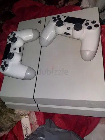 White ps4 fat with 2 joysticks and one game