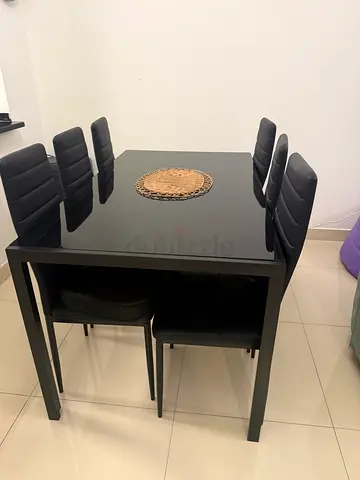 Black modern dining table with 6 chairs - good condition. Great condition as new.