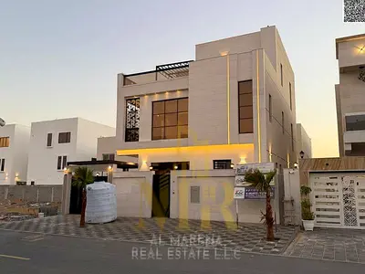 Luxury 7-bedroom villa with a rooftop terrace for sale in the Al Bahia area, Ajman—registration and ownership transfer fees included. Featuring high-e