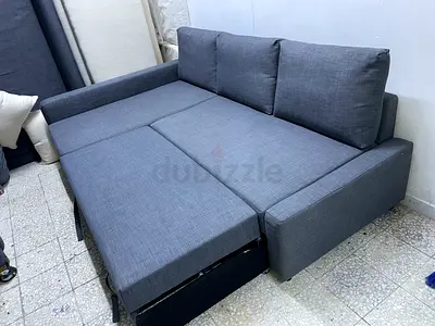 Grey fabric sofa bed with pull out extension