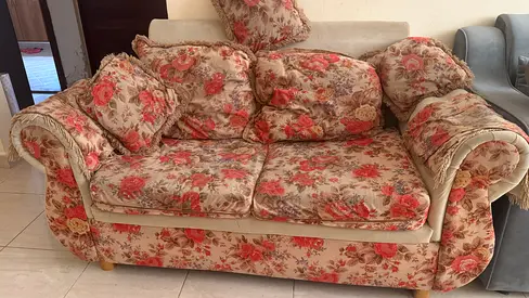 Two-seater floral upholstered sofa in good used condition