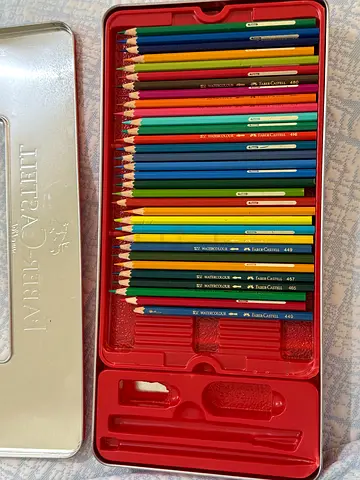 Used Faber-Castell colored pencil set in metal tin - 72 pencils (4 missing, some used)