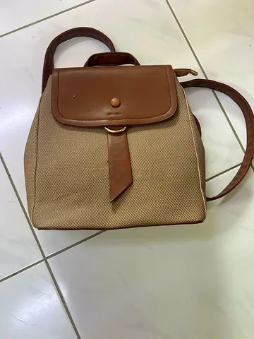 Beige and brown structured tote handbag with top handle and shoulder strap