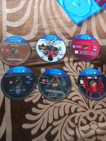 Collection of PS4 Game Discs with 400 AED🔥 games🎮: Spider-Man, Hitman 2, Uncharted, Diablo and SF.