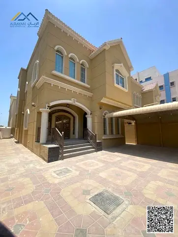 An exceptional residential rental opportunity in Al Muwaihat 3. A two-story villa for rent, situated in a vibrant area featuring charming natural scen