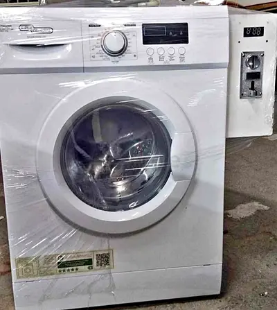 Coin operated washing machine system available for labour camp residential buildings and villas