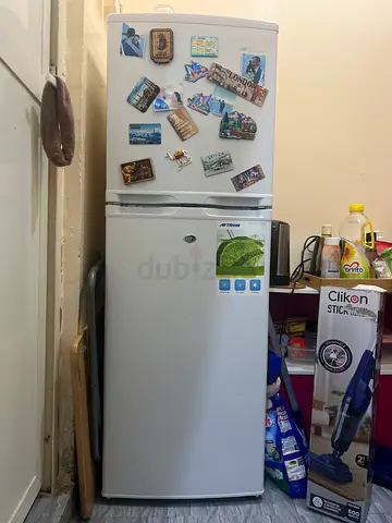 Used white top-freezer refrigerator - good working condition