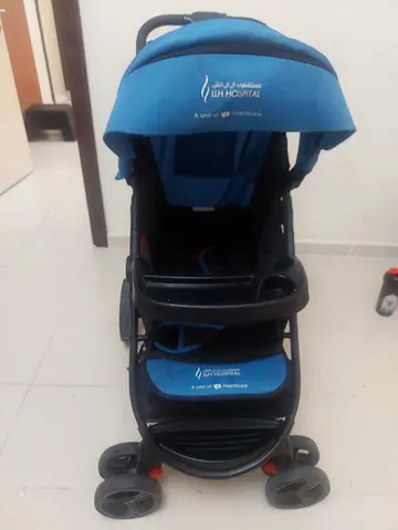 Lightweight blue baby stroller in good condition