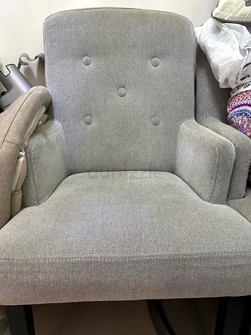 Light grey upholstered lounge armchair in good condition