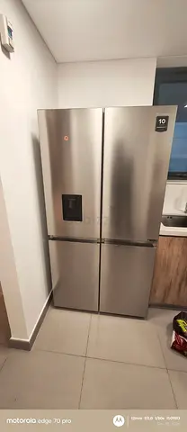 Hisense 4-Door Stainless Steel Fridge with Water Dispenser - Good Condition