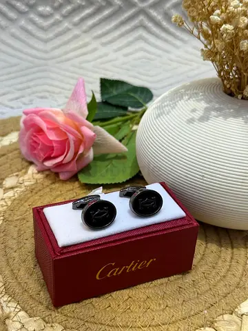 Cartier black cufflinks in original box