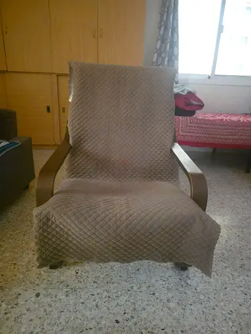 Wooden framed rocking/recliner chair with quilted cover