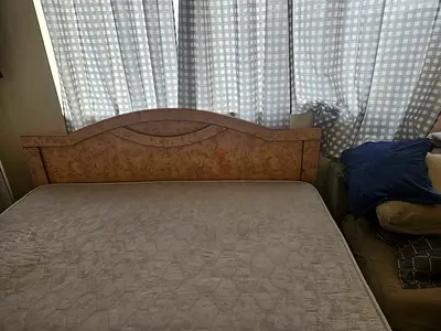 Queen size wooden bed frame with headboard - good condition. Mattress and 1 side table available.