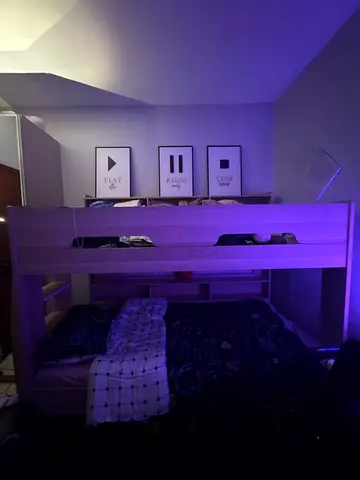 Double Modern Bunk Bed with Built-in Storage,including its mattress with the plastic cover of it.