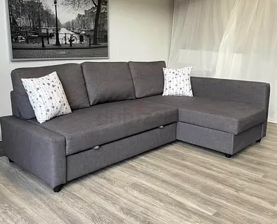 Grey L-shaped Sofa with Storage and Pull-out Bed - Good Condition