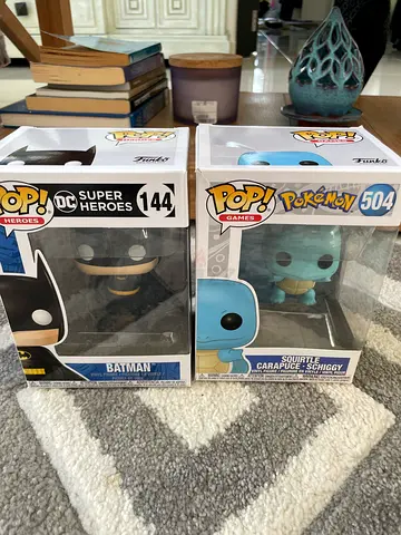 2 funk pops (Batman 144) & (Squirtle 504)