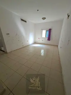 Apartment for Annual Rent in Al Butina, Sharjah A spacious one-bedroom apartment with a living room,