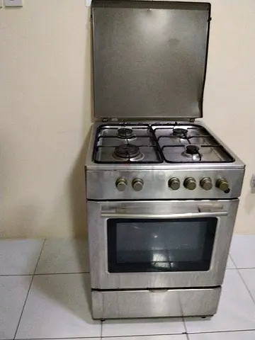 Used stainless steel 4-burner gas stove in working condition.
