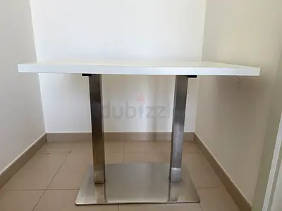 White rectangular table with stainless steel legs - compact
