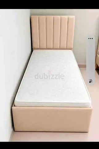 Single beige upholstered bed with mattress - good condition