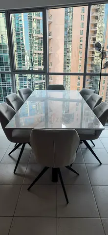 8-Seater Marble Top Dining Table with 8 Rotatable Upholstered Chairs - Modern Set. 220 x 100 cms.