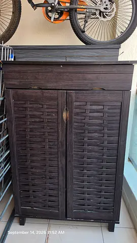 Dark Wood Storage Cabinet with Woven Door Detail