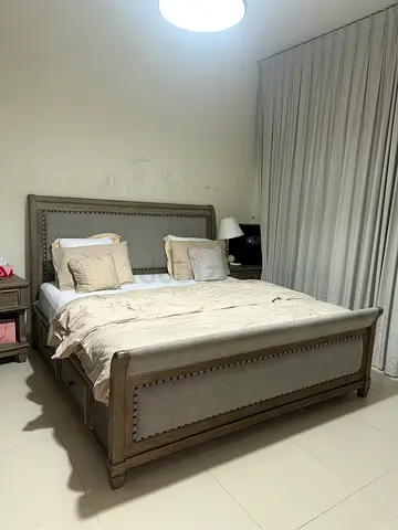 King size wooden bed frame with upholstered headboard and storage