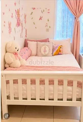 2 single white beds with 2 mattresses