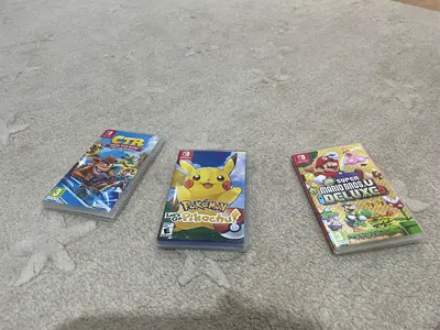 Three Nintendo Switch Games – Super Mario, Pokémon, and CTR  2 games with no boxes