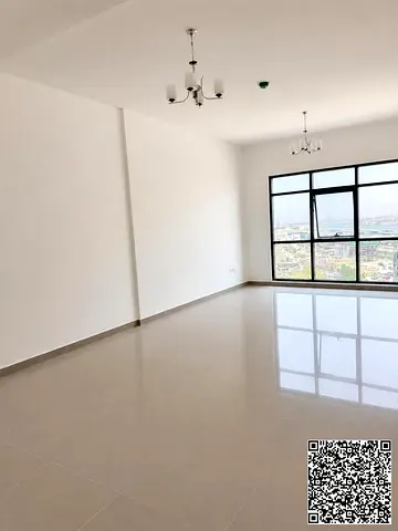 A brand-new one-bedroom apartment with a living room is available for rent in Al Bustan, Ajman