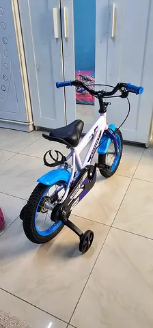 Kids Bicycle with Training Wheels - Blue & White 100 AED -like New
